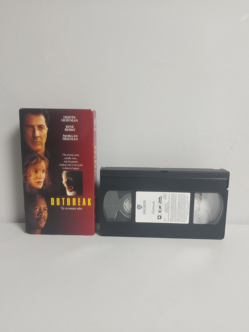 Outbreak (VHS) Black Tape with Red Jacket